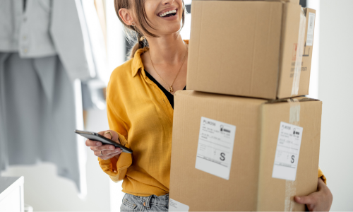 Woman carrying boxes