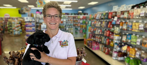 Bone-A-Patreat owner holding a pug